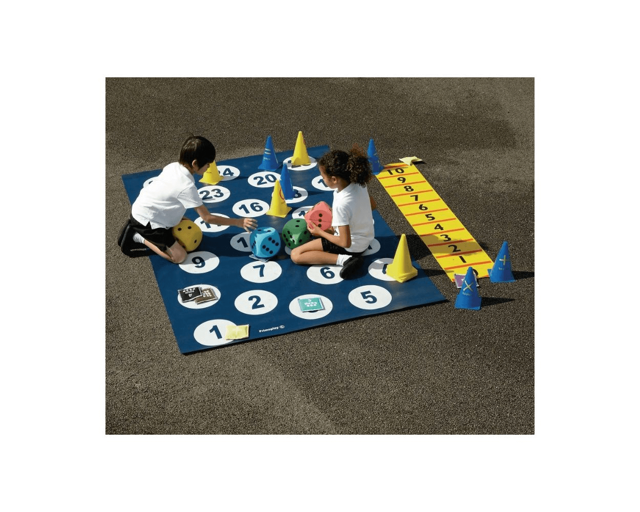 a number mat that is placed outside in a playground with the children sitting on it playing a game