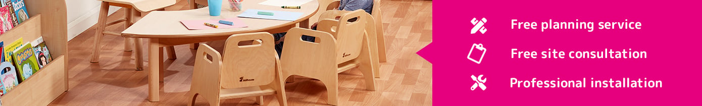 an early years half horseshoe shaped table with chairs in a classroom