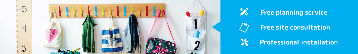 Coat hooks with coats and bags on the pegs